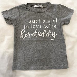 Heather grey tee shirt with “just a girl in love with her daddy,” in size 2T!